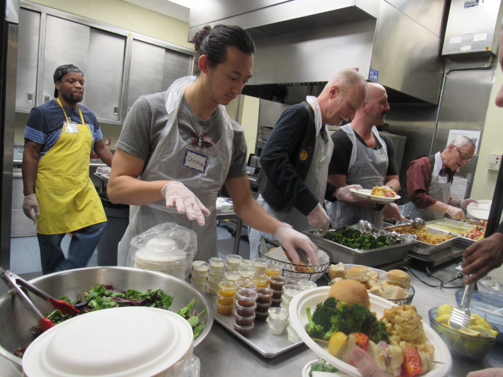 Volunteers serving dinner at SWC