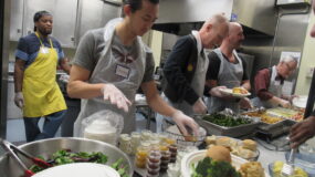 Volunteers serving dinner at SWC